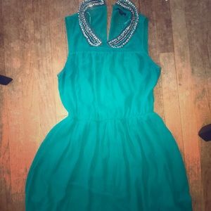 Green sleeveless dress with bejeweled collar